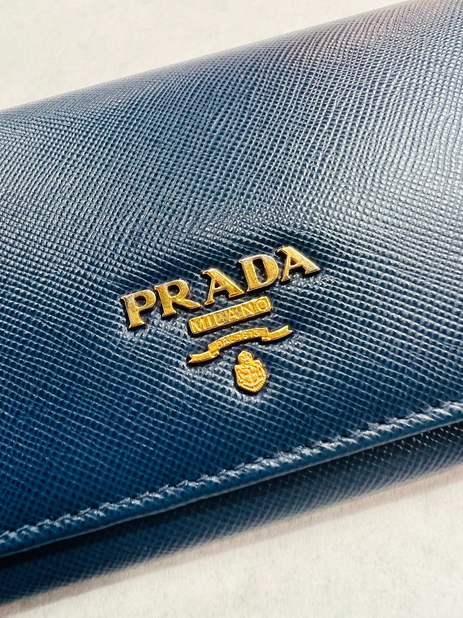 Authentic, pre-owned PRADA Blue Saffiano Leather Zippy Wallet