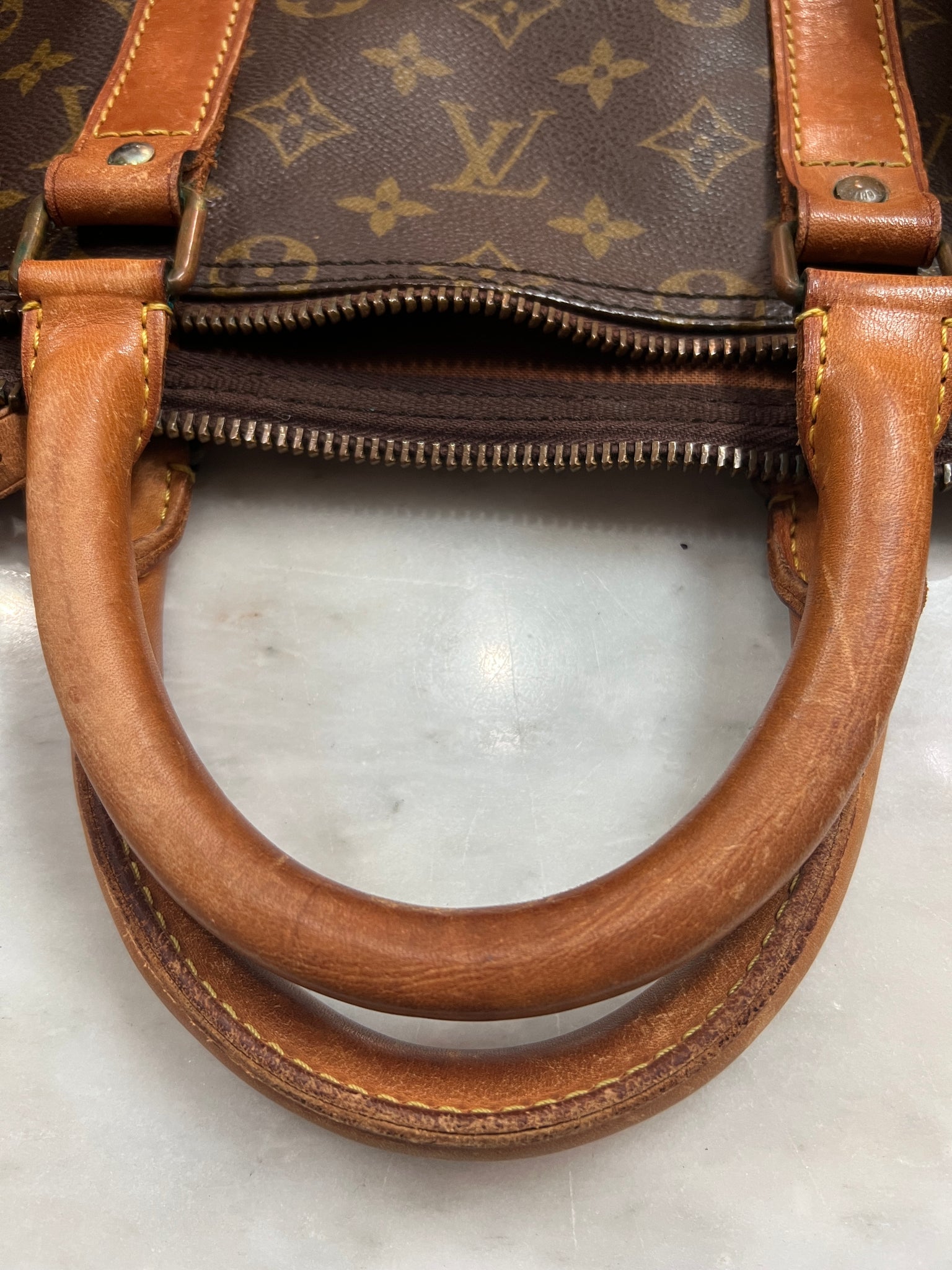 LOUIS VUITTON Lot composed of a Speedy, 40 cm, a Keepal…